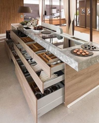Ilha de cozinha completa, com gavetas, cooktop e cuba.
