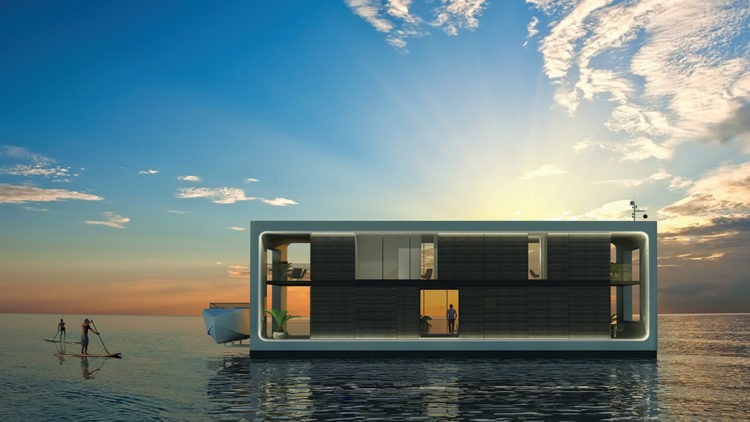 Esqueça a casa de praia: pense em uma casa (literalmente) sobre o mar. Casa flutuante, retnagular com dois andares, no meio do mar