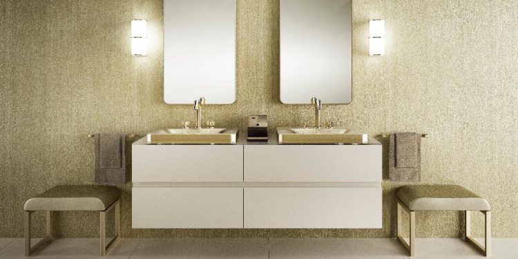 Banheiro de luxo, bancada branca com cubas douradas da marca Armani Casa