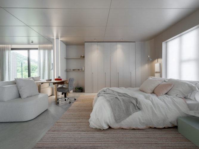 Quarto amplo e claro no espaço de uma mostra de decoração, cama branca, armário e sofá branco 